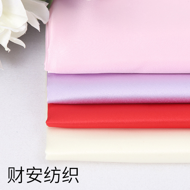 厂家批发现货涤纶面料 斜纹时装抱枕婚纱缎服装面料现货供应
