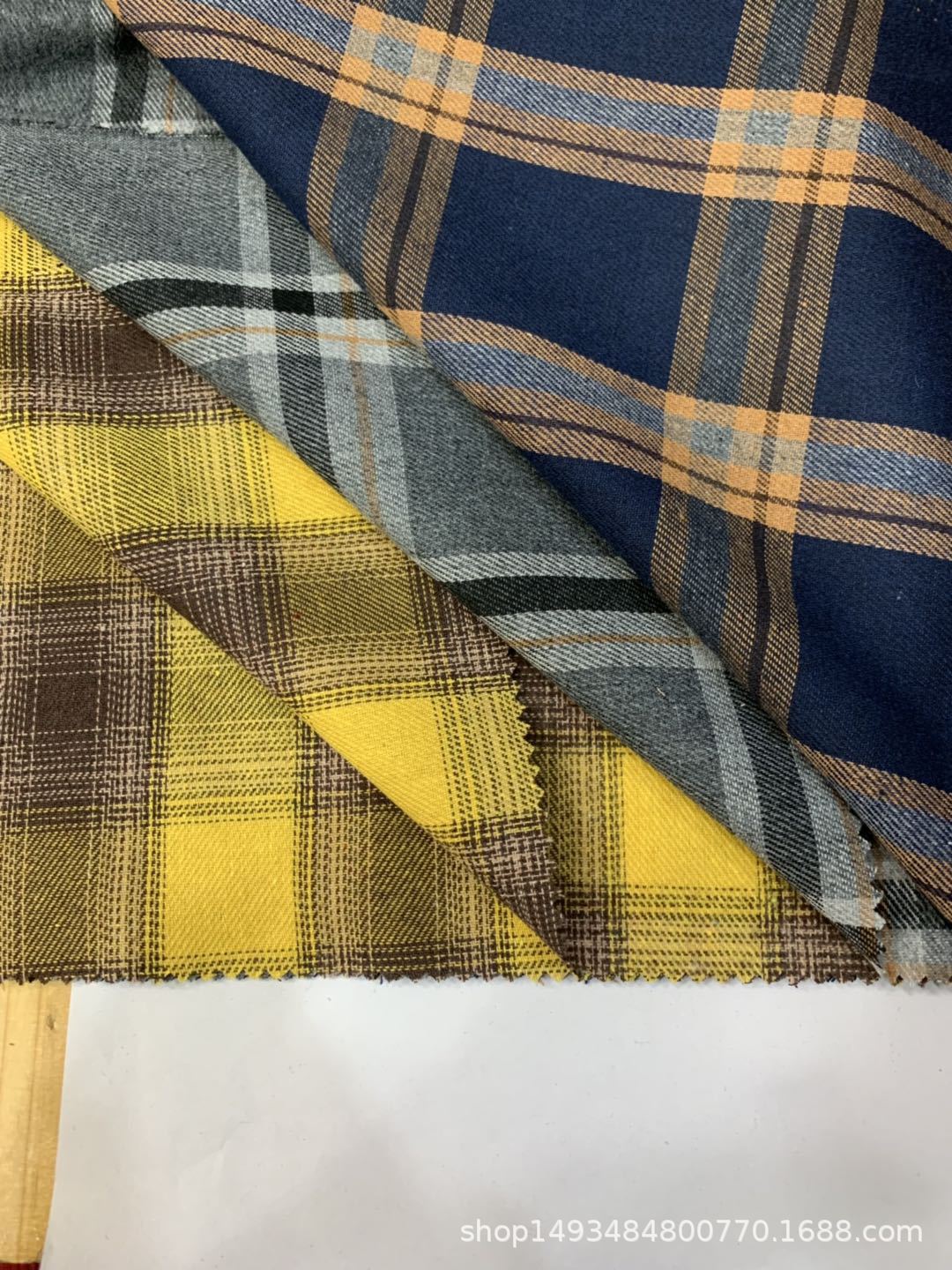 厂家直销现货供应21支色织梭织斜纹单面磨毛爆款男装时尚衬衫面料