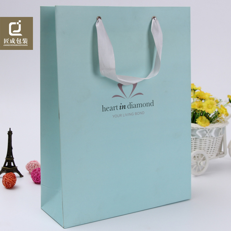 广州供应方底白卡纸袋定做彩印环保服装购物袋广告礼品手提袋定制