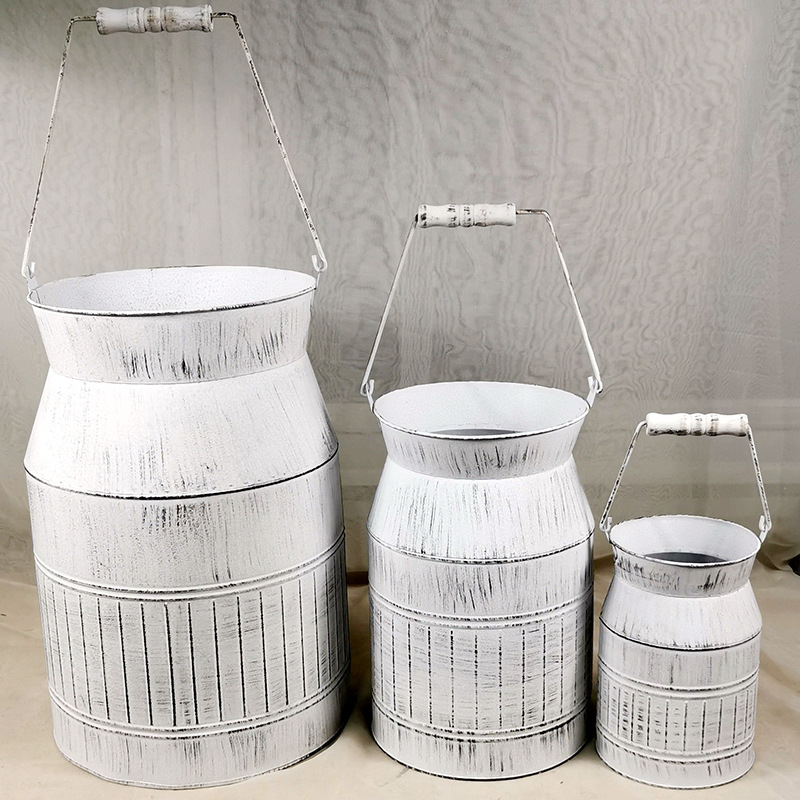 Set of three iron sheet flower arrangement milk cans with iron wire…