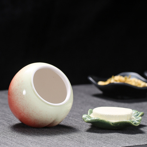Creative ceramic peach-shaped tea canister, small-sized sealed jar with custom logo engraving—Fushengfan Peach-themed Pu-erh Tea Storage Container for Home Use, Wholesale