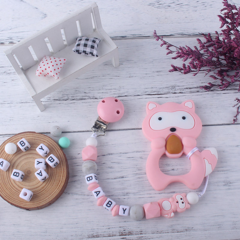 Teether chupete cadena bebé chupete de silicona clip Amazon Comercio exterior teether traje nuevo mapache la historieta