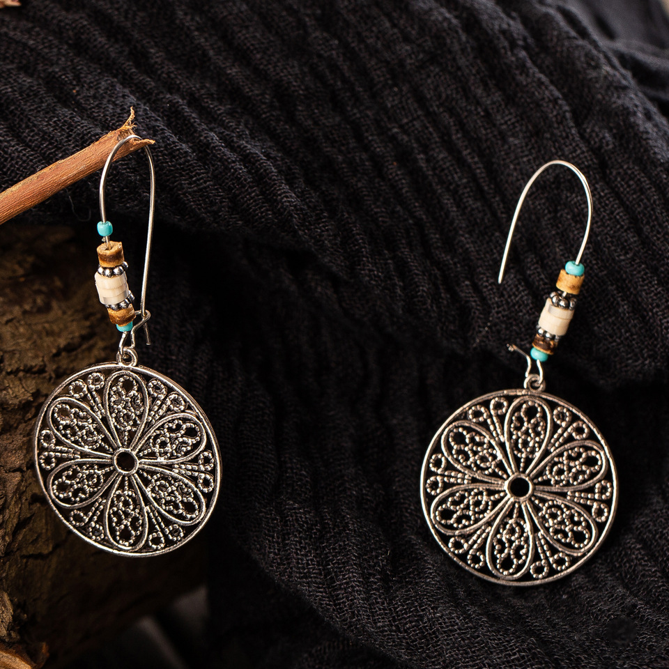 Retro Old Hollow Round Flower Alloy Long Earrings display picture 11