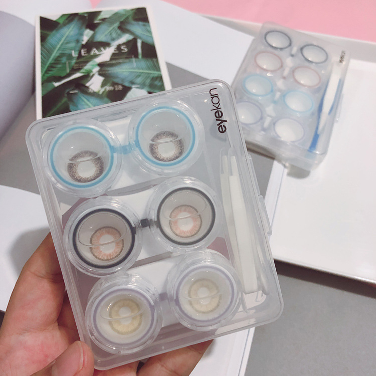 Transparent cosmetic box with three pair...