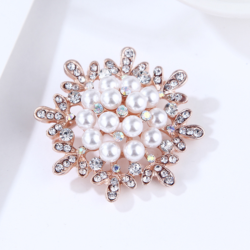 Spilla girasole con perle e strass oro rosa per donna_voghion.com