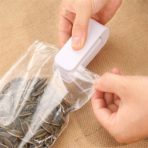 Mini small sealing machine food preservation plastic bag sealer hand pressure heat sealing machine bag sealing clip
