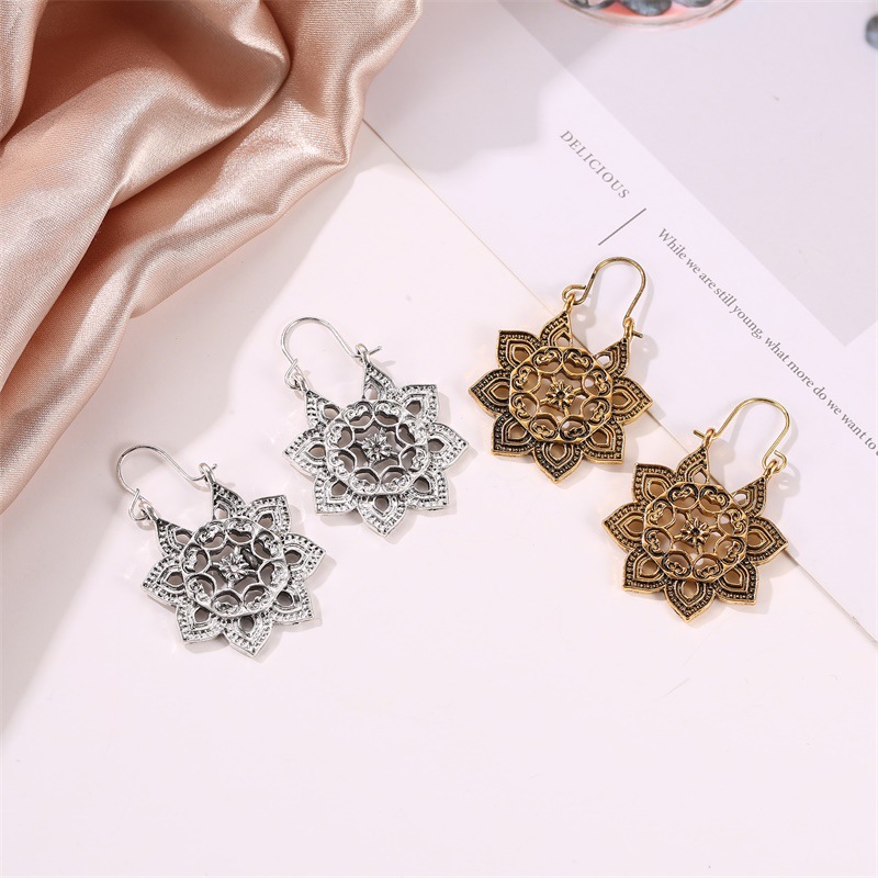 New Bohemian Metal Carved Retro Hollow Flowers Ear Buckle Earrings Wholesale display picture 2