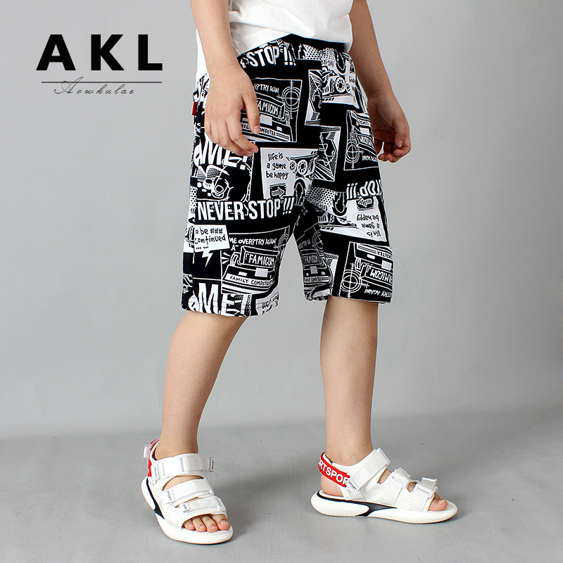 Children's pants 2022 summer Korean version new children's five point shorts big children's cotton beach pants boys' pants wholesale