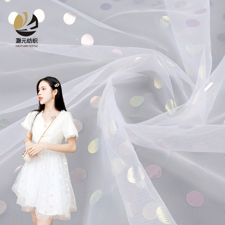 Fabricante suministro de punto láser estampado fantasía color blanco tela de malla de tela de ropa de chicas