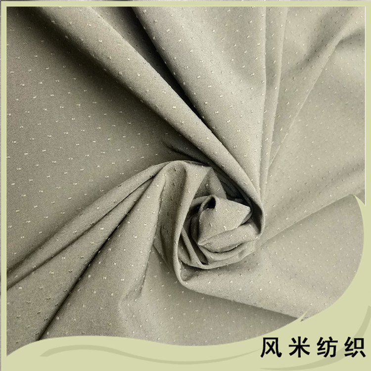 50D小点子立体感提花涤纶四面弹棉服面料提花弹力布工厂定做