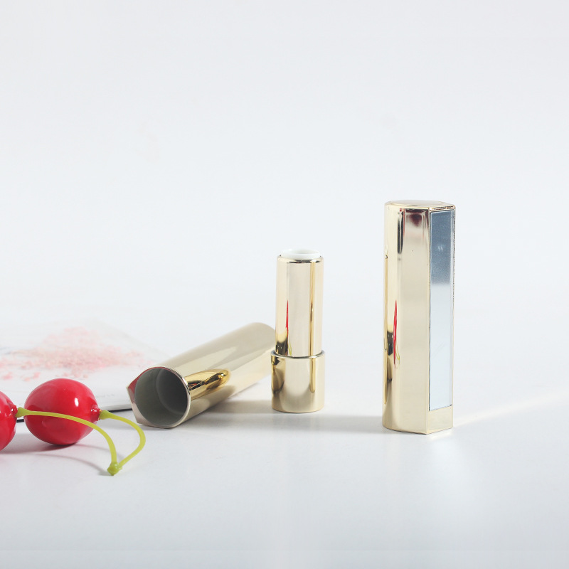 En stock tubo de lápiz labial al por mayor con espejo suministro de plástico 12,1 calibre primavera oro negro rojo paquete de maquillaje lápiz labial tubo vacío