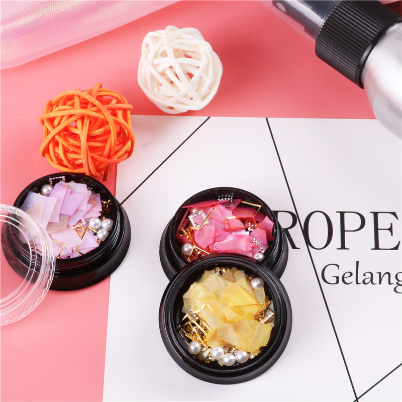 Suministro transfronterizo nuevo arte de uñas Tormenta marina arte de uñas remache de diamantes pieza de concha de perla decoraciones mixtas al por mayor