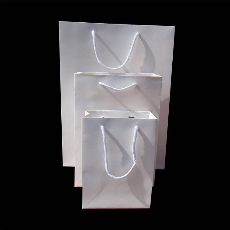 通用白卡手提袋定制牛皮纸广告购物纸袋服装礼品包装纸袋定做logo