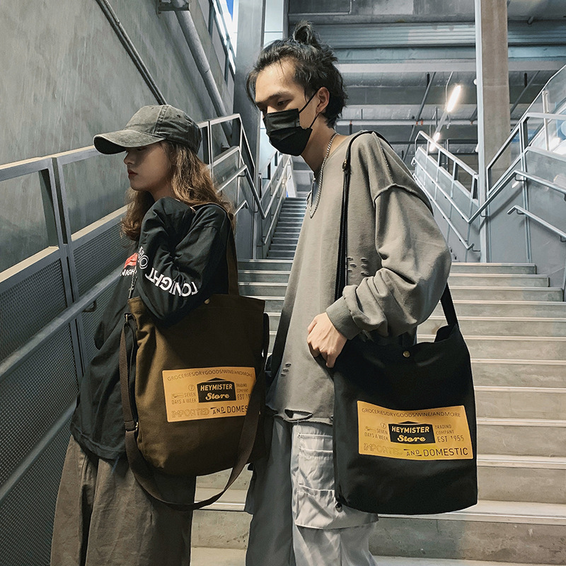 Canvas bag LOGO shoulder bag for women Korean style student fashion crossbody bag for men casual creative backpack