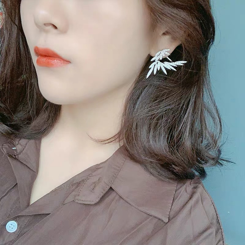 boucles d'oreille aile d'ange portées