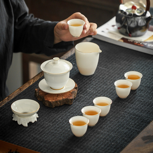 High-end white porcelain tea set with high-quality Dhua sheep fat jade, gold-trimmed ceramic Sandai cover bowl Gongfu tea set for wholesale