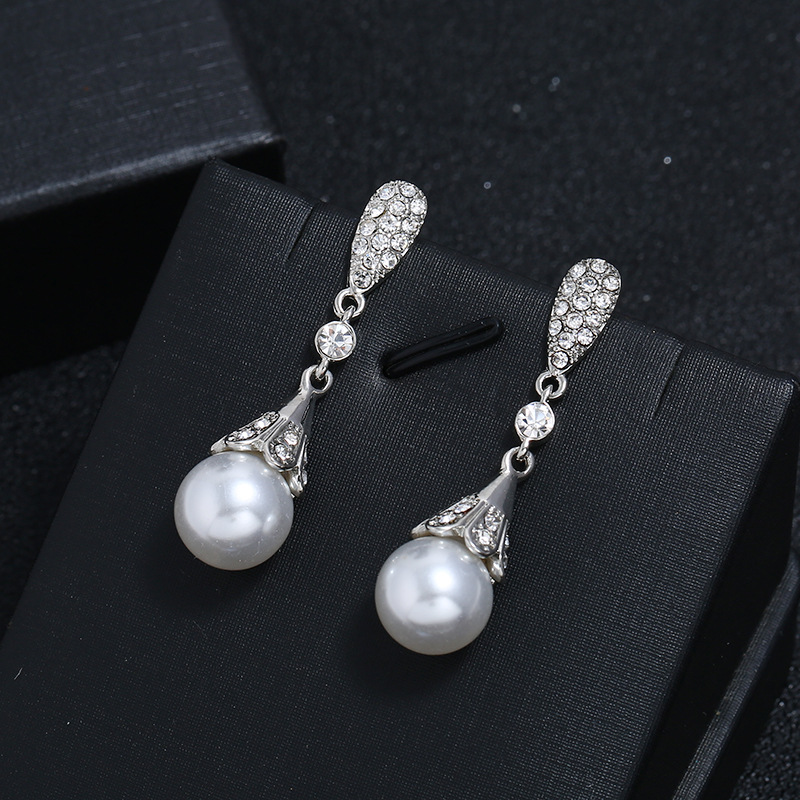Long elegant cute earrings from pearl with tassels