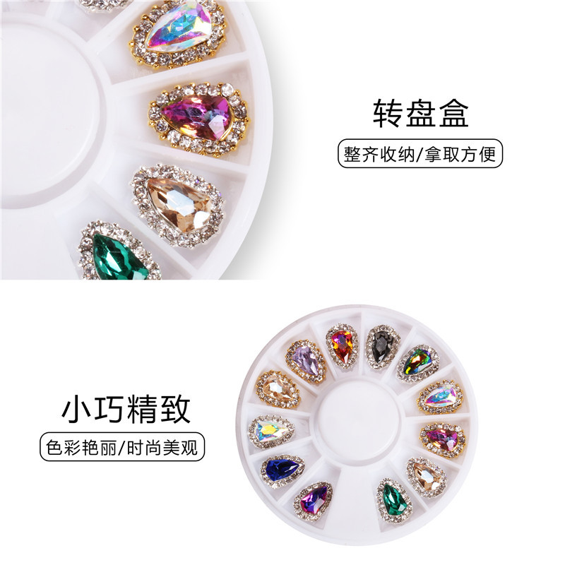 Joyería de uñas de lujo exclusiva transfronteriza al por mayor de aleación de escudo mágico colorido diamante joyería de uñas grande placa giratoria