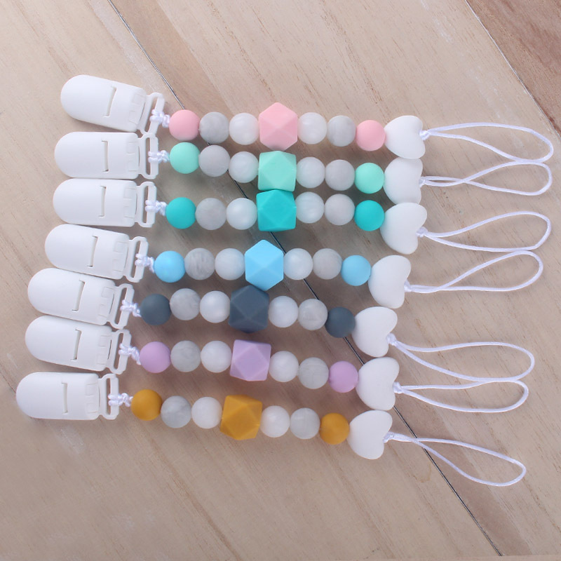 Productos para bebés de silicona chupete cadena mordedor pluma de dibujos animados de silicona juguete dientes molienda teether traje