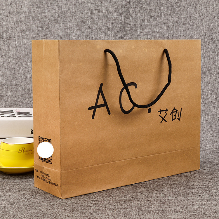 牛皮纸袋服装手提白卡纸广告购物袋礼品包装袋子印刷ogo
