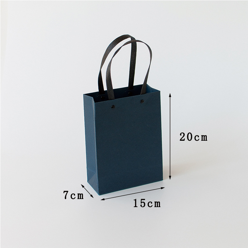 Solid color rivet gift bag-blue trumpet; White cardboard; Figure