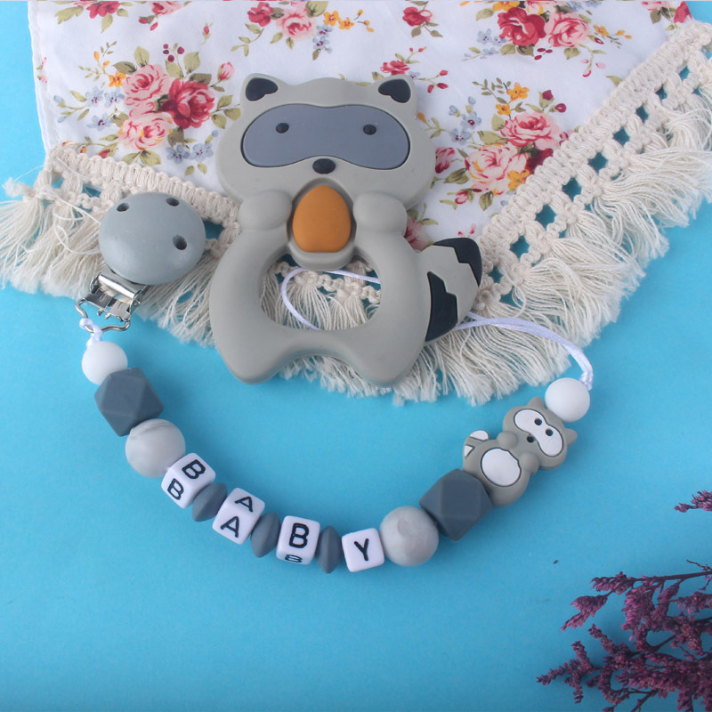 Teether chupete cadena bebé chupete de silicona clip Amazon Comercio exterior teether traje nuevo mapache la historieta