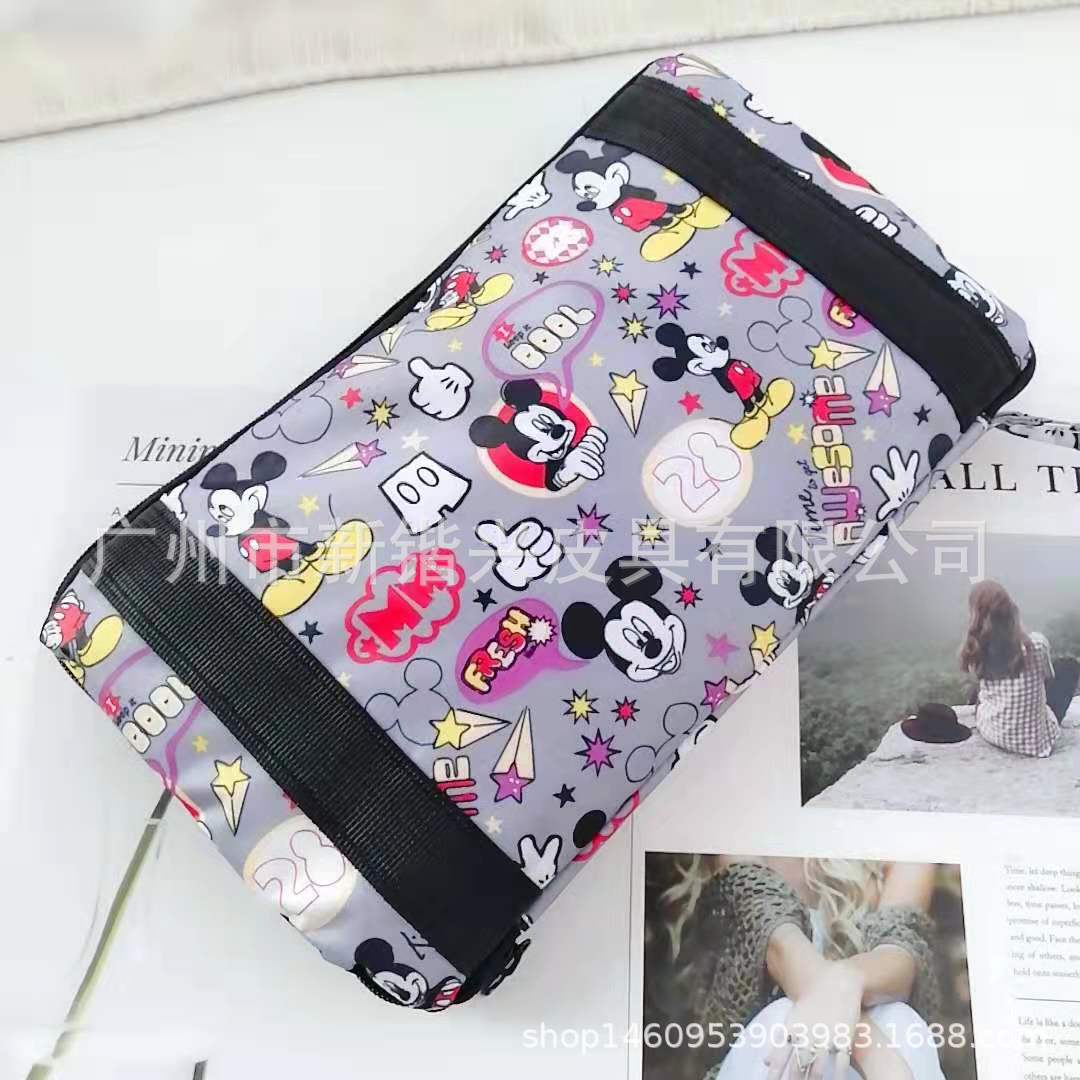 布丁犬玉桂犬美楽蒂k.t防水アニメ携帯折りたたみ旅行バッグはスーツケースに固定できます。