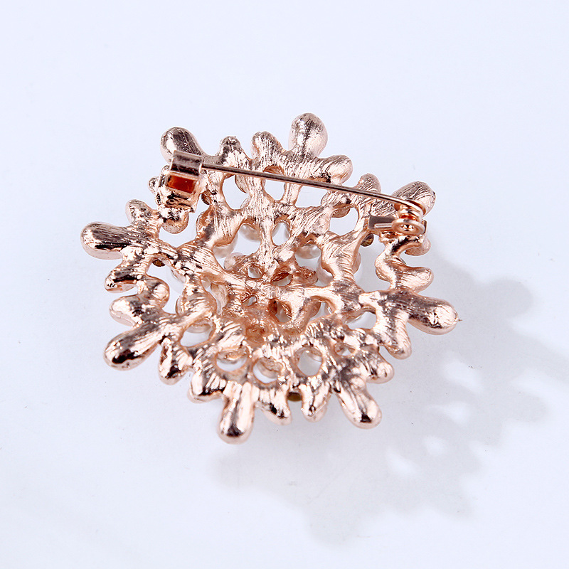 Spilla girasole con perle e strass oro rosa per donna_voghion.com