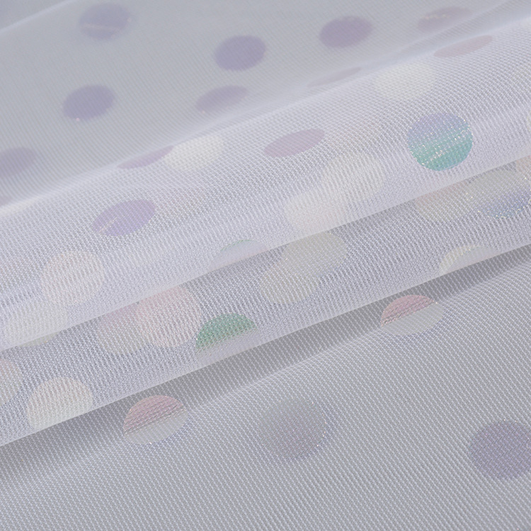 Fabricante suministro de punto láser estampado fantasía color blanco tela de malla de tela de ropa de chicas