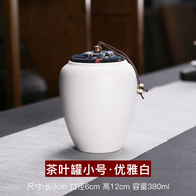 Fábrica al por mayor de cerámica tetera sellada tarro pequeño tamaño hogar almacén de té portátil juego de té pequeño tetera personalización