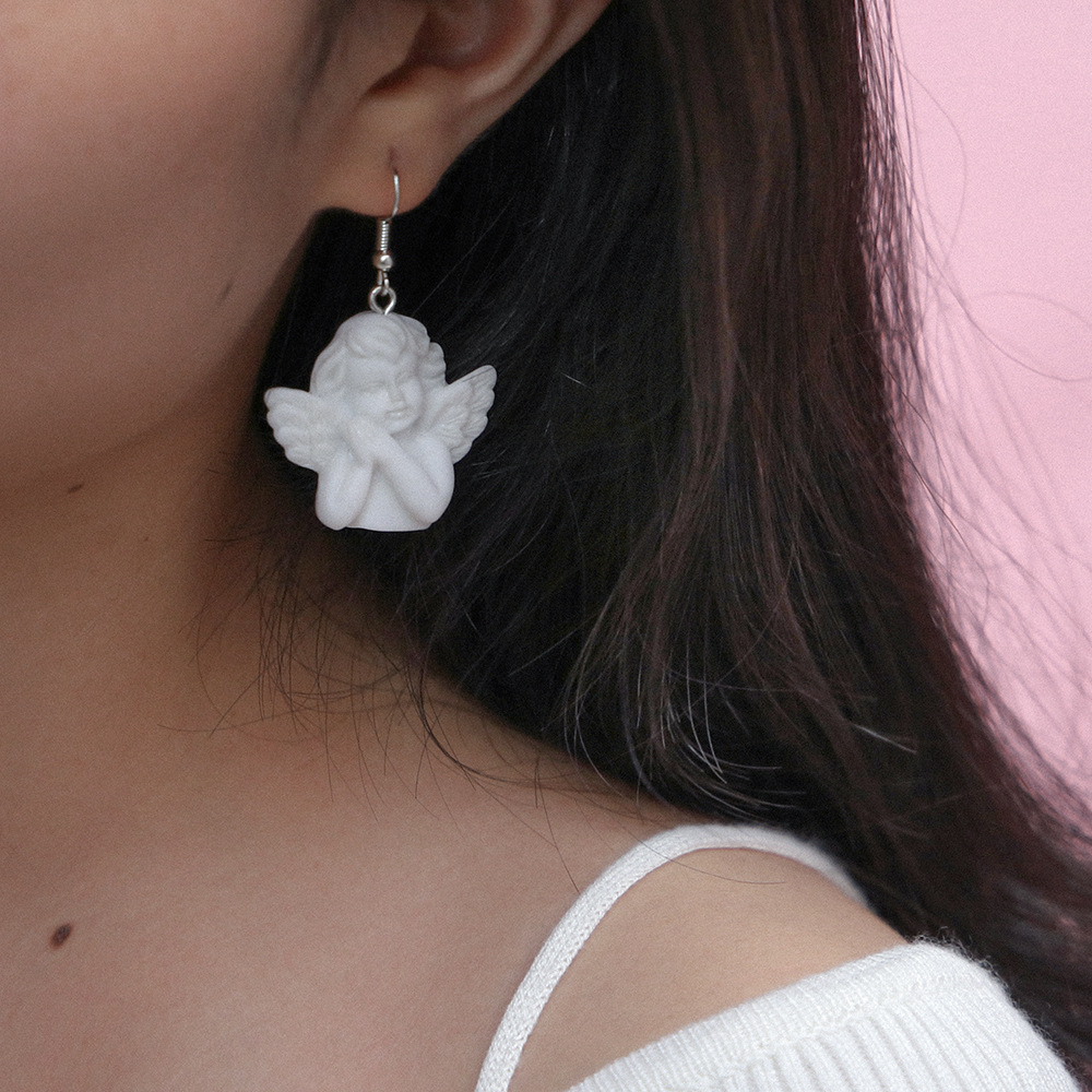 boucles d'oreille ange portées