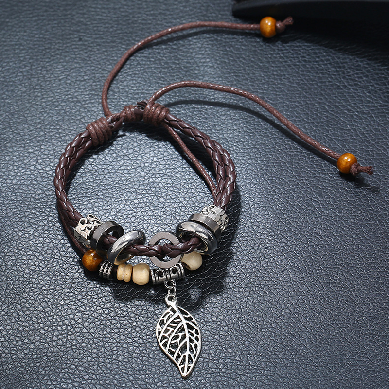 Korean Version Of Imitation Cowhide Bracelet Simple Wild Alloy Leaf Pendant Woven Leather Bracelet display picture 8