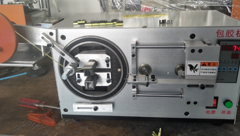 圆形磁芯自动包膜机包胶带机各种变压器产品磁芯自动包胶机1948