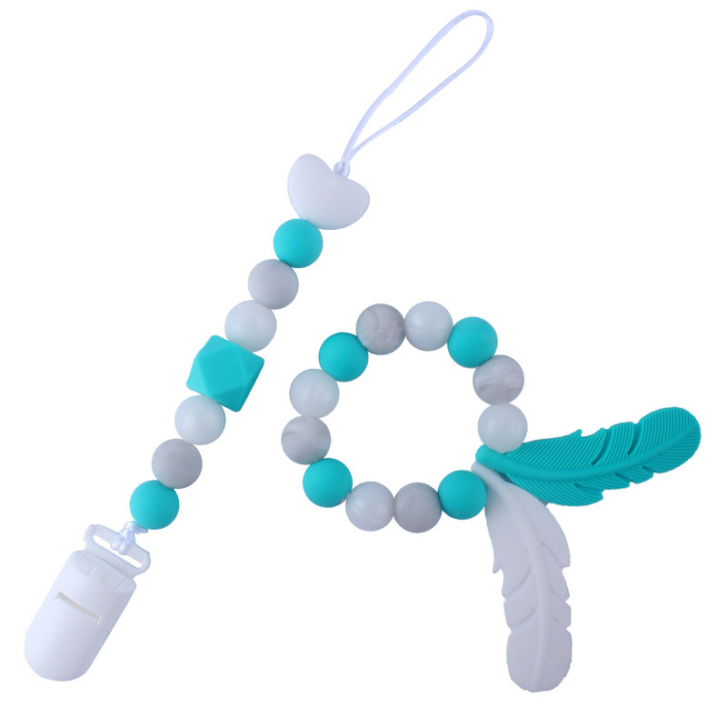 Productos para bebés de silicona chupete cadena mordedor pluma de dibujos animados de silicona juguete dientes molienda teether traje