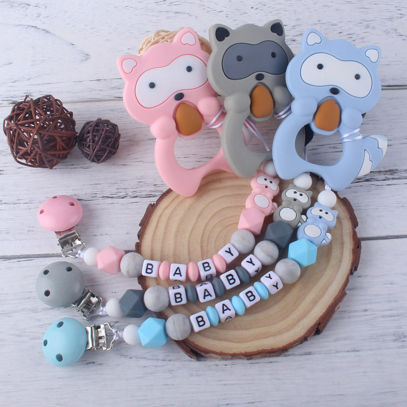 Teether chupete cadena bebé chupete de silicona clip Amazon Comercio exterior teether traje nuevo mapache la historieta