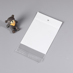 Factory wholesale white OPP transparent self-adhesive pearlescent film with dual-purpose hanging holes—ideal for nail accessories and wearable jewelry; available in plastic packaging bags.