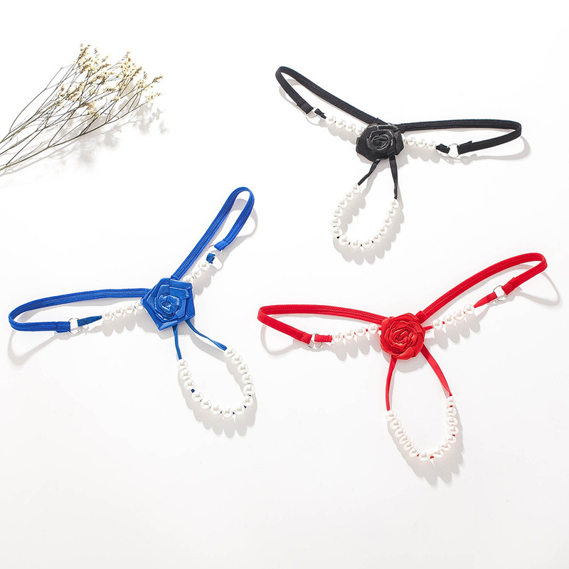 On behalf of the export of European and American sexy pearl massage T pants rose thong underwear women's low waist open transparent temptation 162