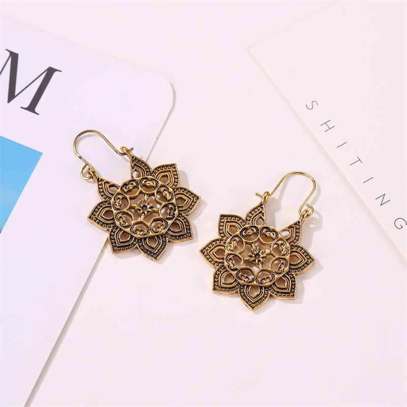 New Bohemian Metal Carved Retro Hollow Flowers Ear Buckle Earrings Wholesale display picture 5