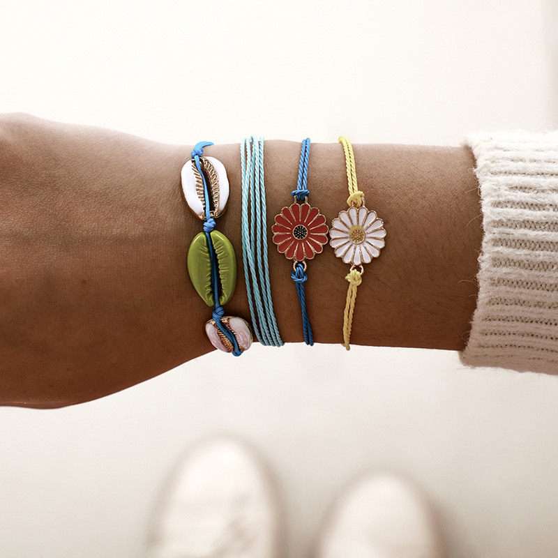 Europäische Und Amerikanische Grenz Überschreitende Hand Gewebte Ins-wind Legierung Gänseblümchen-muschel Armband Mehr Schicht Iges Seil Blumen Armband 4-teiliges Set display picture 2