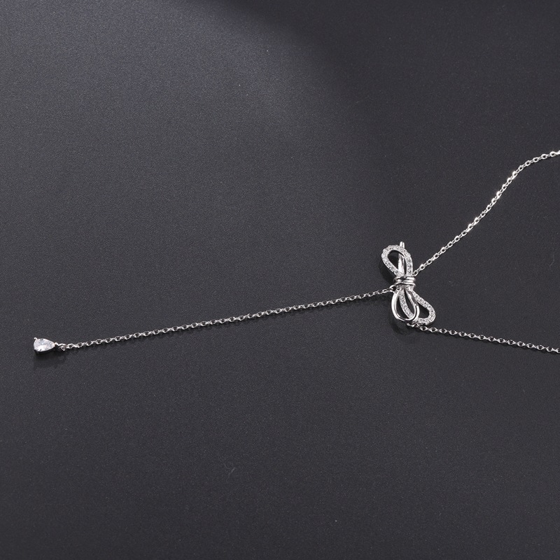 Copper long necklace with bow with zircon