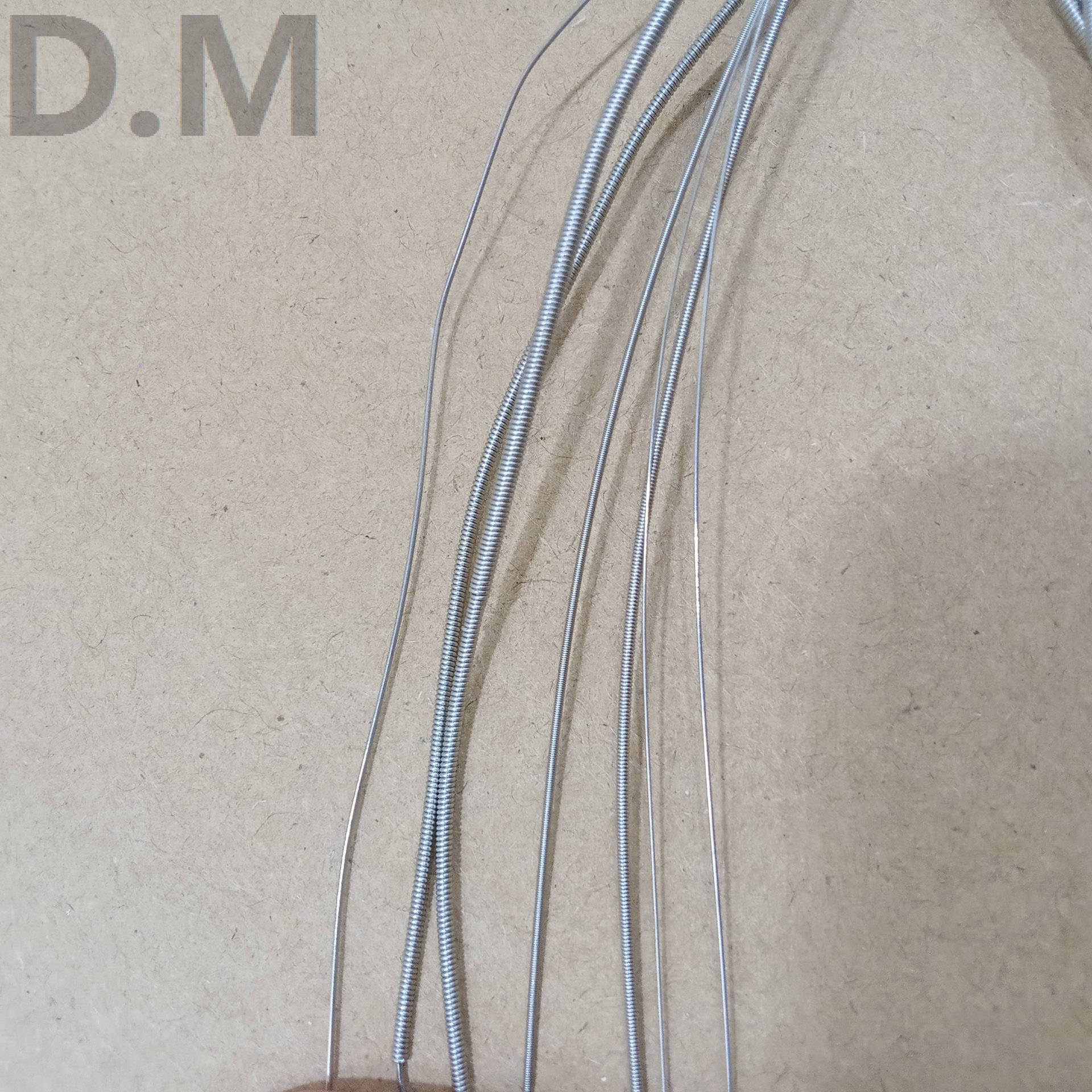 7 cuerdas de cuerda de guitarra eléctrica de siete cuerdas de guitarra eléctrica cuerda de acero de alta calidad hexagonal cuerda de guitarra eléctrica embalaje independiente