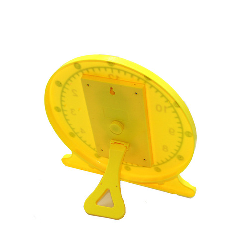 Children recognize time alarm clock. Educational toy for first and second grade primary school students. Cognitive digital toy clock model.