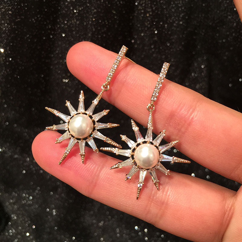 S925 Silver Korean Fashion Eight-bell Star Earrings Micro-set Zircon Luxury Pearl Sun Flower Earrings display picture 1