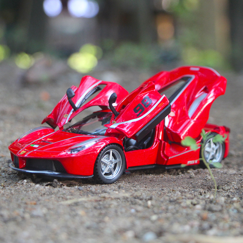 Jiaye rojo FX versión de pista modelo de coche de aleación Tire hacia atrás sonido y luz coche de juguete puerta coche deportivo 32164 en caja