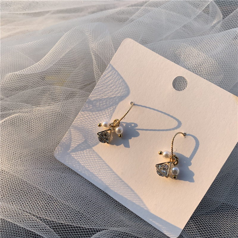 Small shiny earrings with zircon from pearl