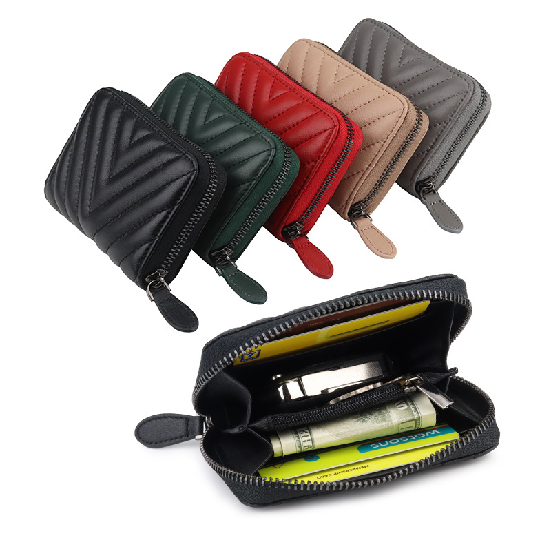 Bolsa de cambio de piel de oveja suave, bolsa de cuero bordada de moda, nueva bolsa de monedas transfronterizas, una bolsa de venta