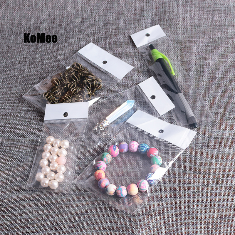 10*12+3cm厂家现货 白色珠光膜卡头袋，饰品袋，包装袋， opp袋