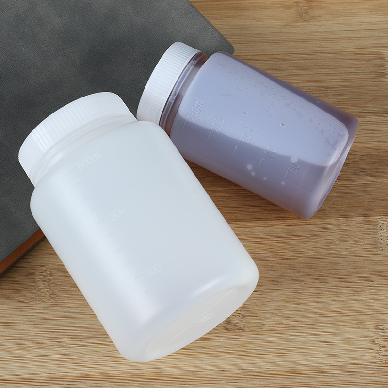 Venta al por mayor engrosada 500ml botella líquida de plástico redonda botella de polvo laboratorio Boca Grande sub-embalaje botella de boca ancha botella de cebo