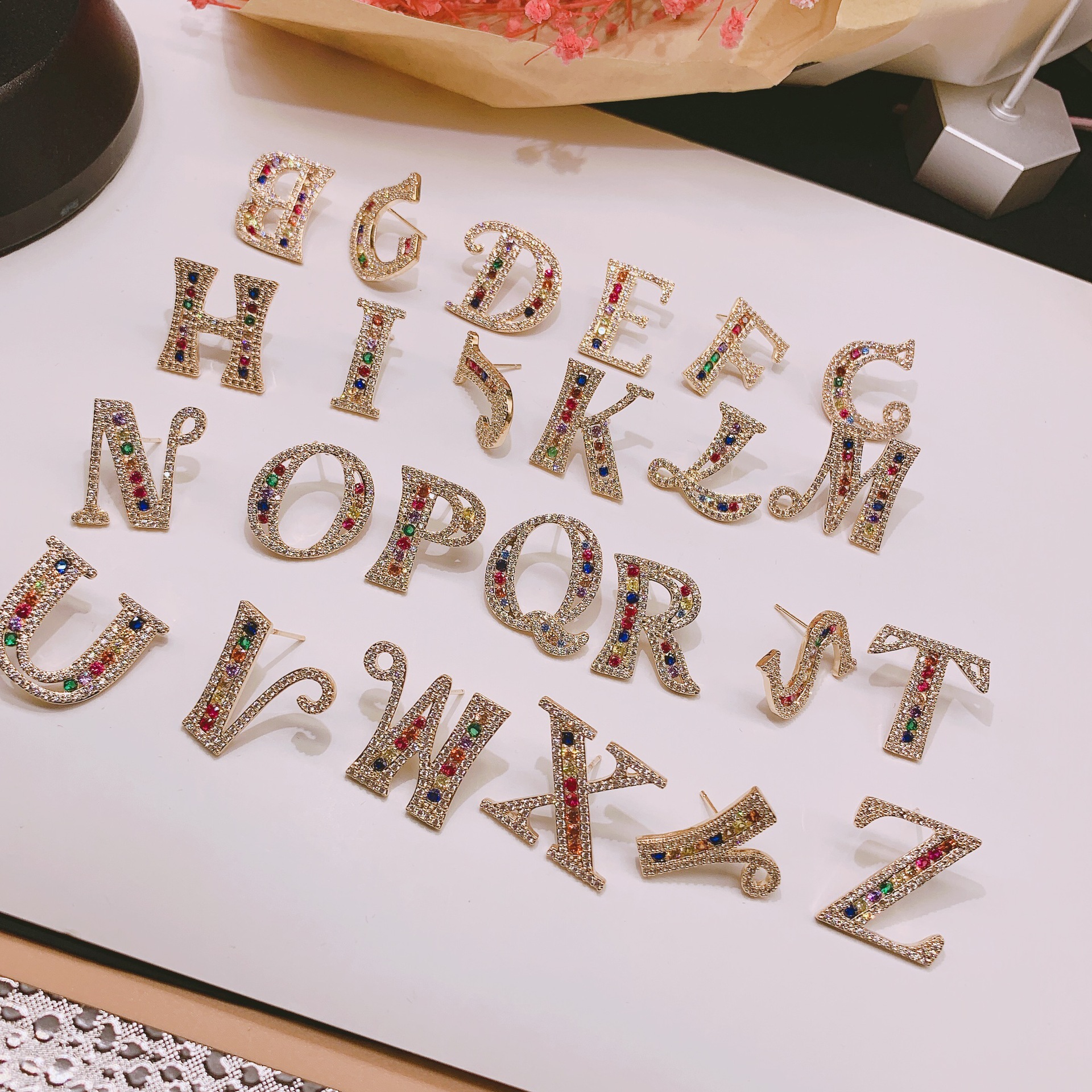 copper earrings with letters with zircon
