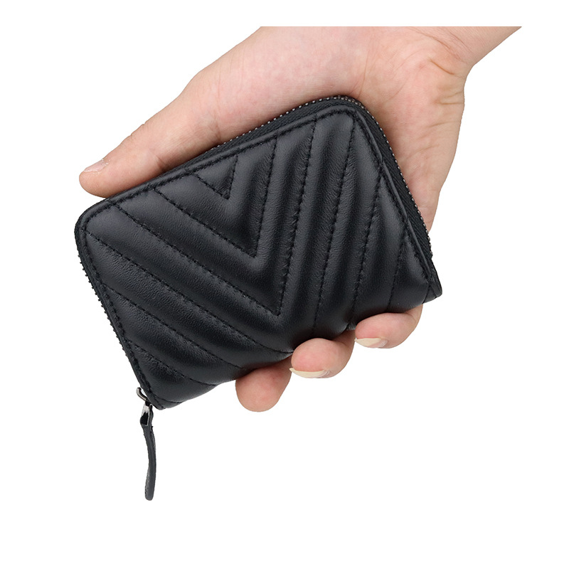 Bolsa de cambio de piel de oveja suave, bolsa de cuero bordada de moda, nueva bolsa de monedas transfronterizas, una bolsa de venta